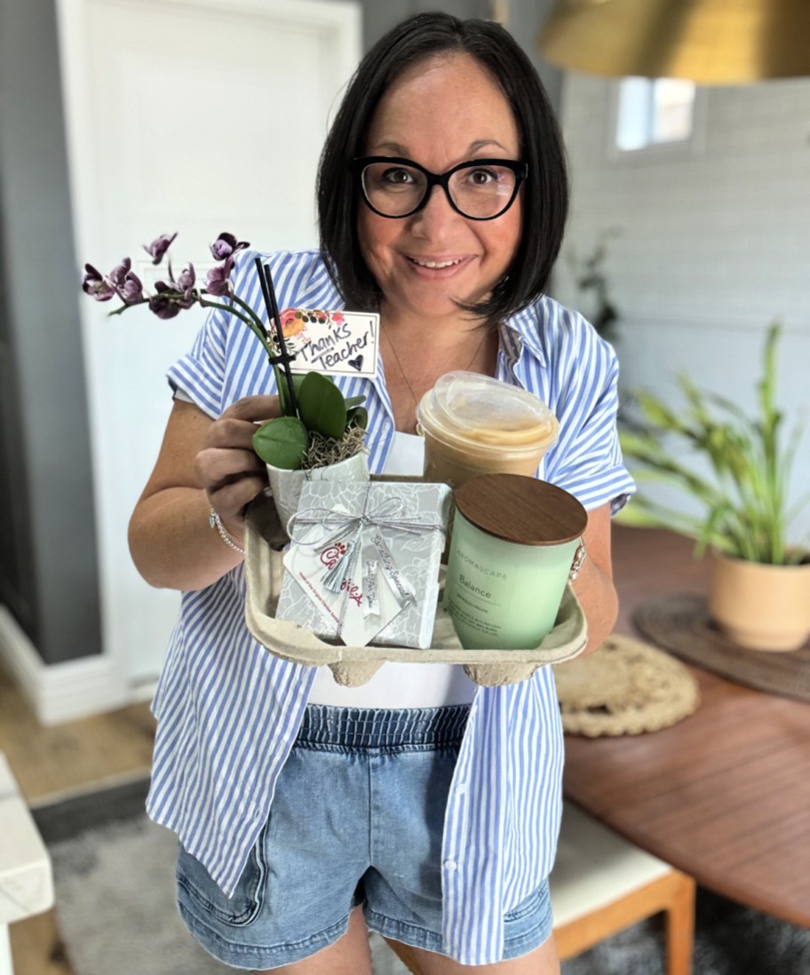 woman holding a last minute teacher appreciation gift in a drink holder