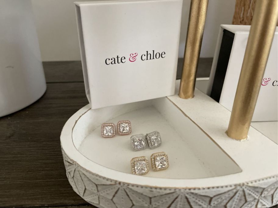 three pairs of square cut earrings in jewelry box 