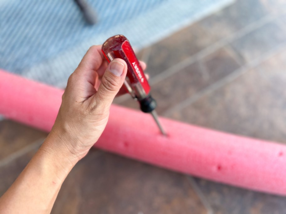 making a diy sprinkler with a dollar tree pool noodles