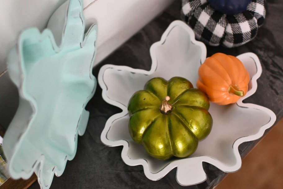 painted fall leaves from dollar tree styled on mantel 