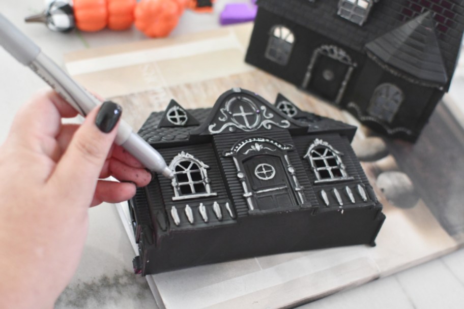 using a silver sharpie on a haunted mansion dollar tree doll house craft