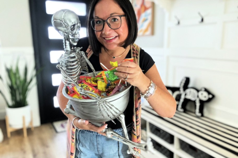 woman-holding-a-diy-halloween-candy-skeleton-bowl-1.jpg