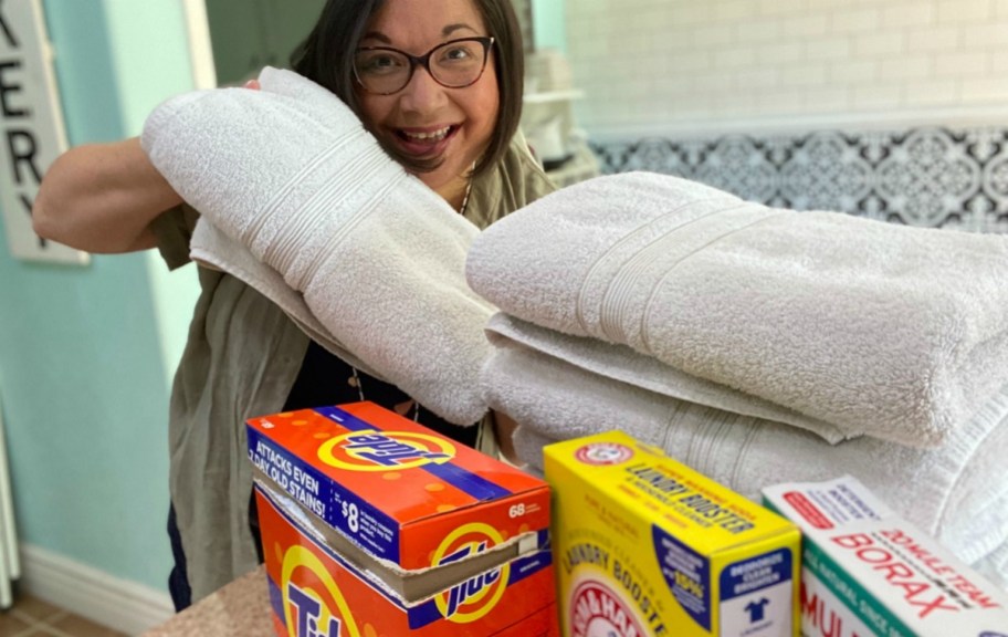 woman holding white towels