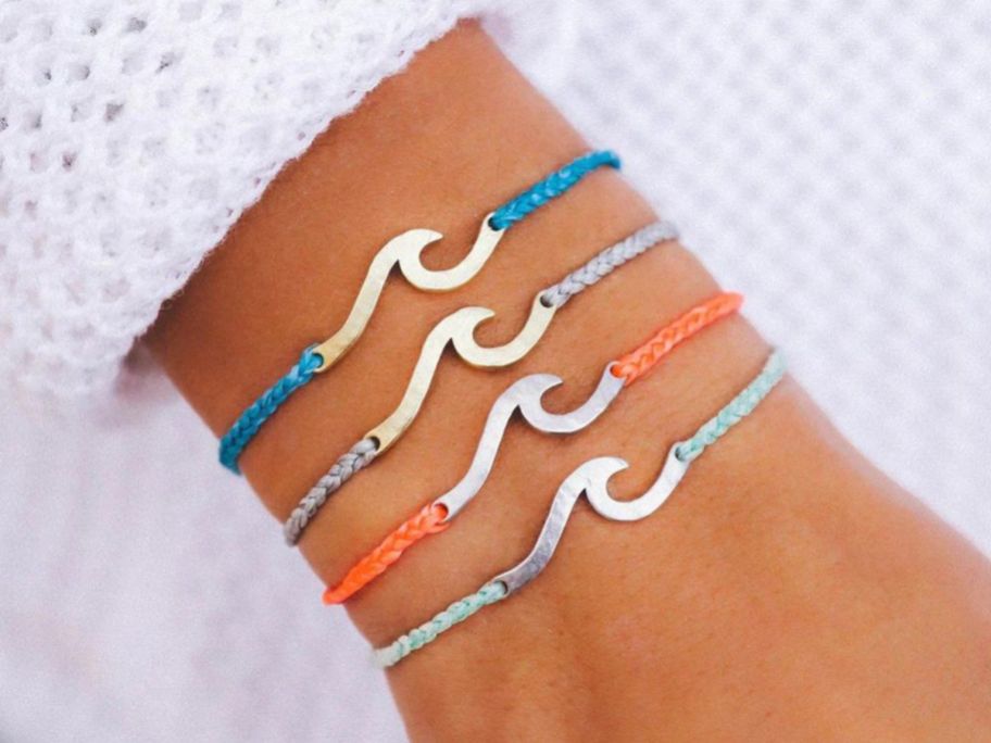 Pura Vida Hammered Wave Charms on wrist