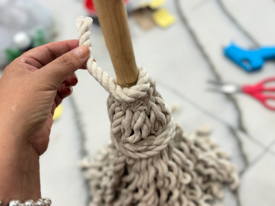 covering hot glue with rope piece