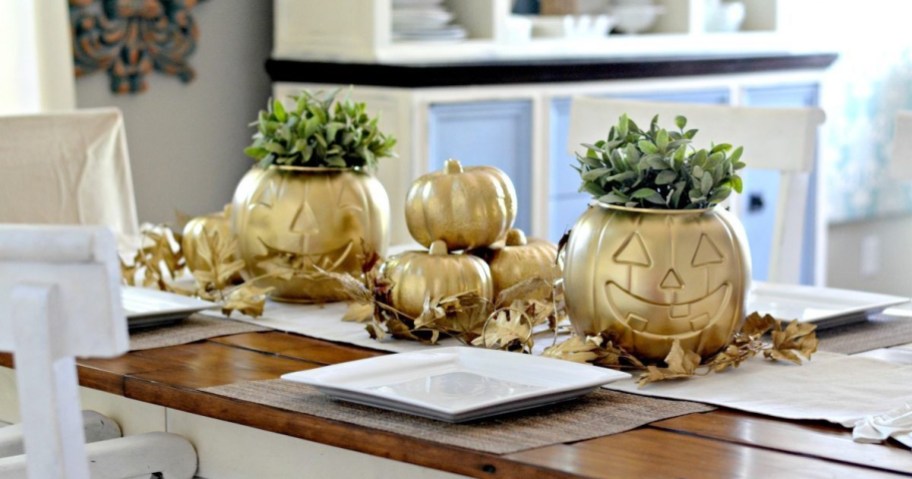 diy halloween decor spray painted gold pumpkins on table