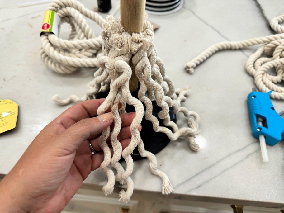 unraveling rope on a broomstick